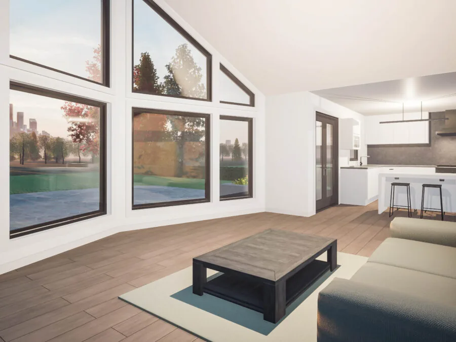 Modern open-concept living room with large windows overlooking a park, featuring a gray sofa, black coffee table, and kitchen with bar seating. (3 of 6)