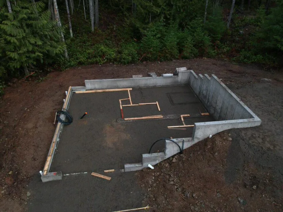 A building site with the excavation open and grades being set
