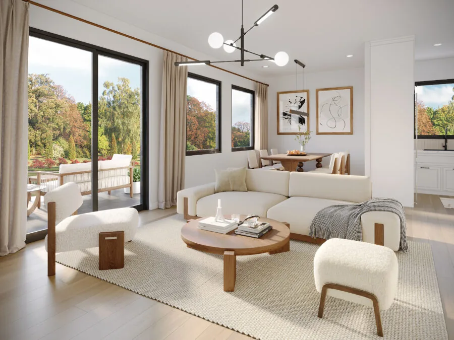 Modern living room with cream furniture, wooden accents, large windows overlooking autumn trees, and contemporary pendant lighting. (3 of 5)