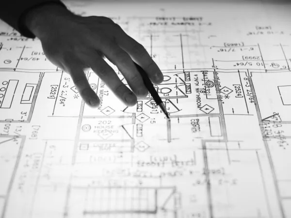 A floor plan being marked up on paper