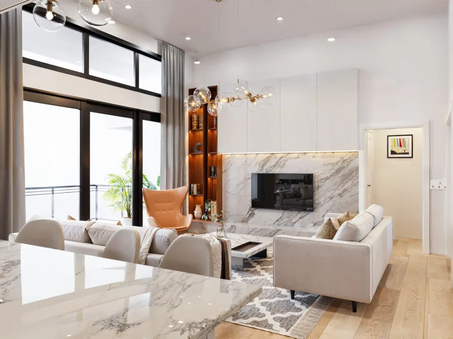 Modern living room with marble fireplace, cream sofa, orange accent chair, and floor-to-ceiling windows overlooking a balcony. (3 of 5)