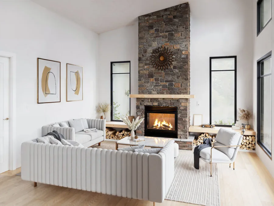 Modern living room with gray sectional sofa, stone fireplace with burning insert, and wood flooring. (2 of 4)