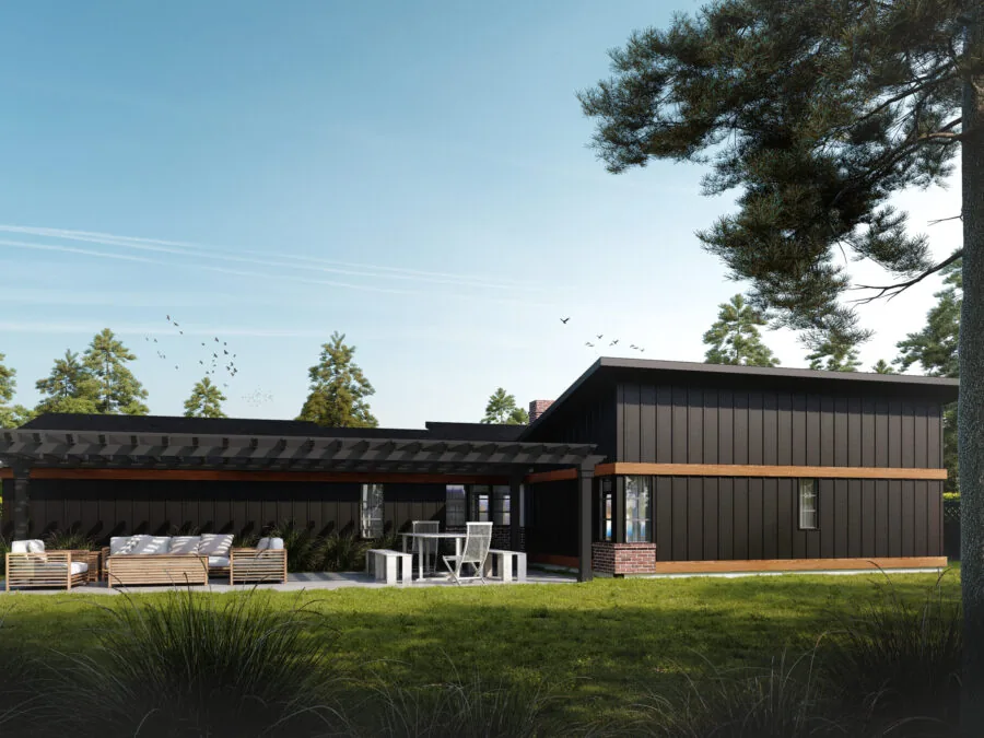 Modern black residential home with covered patio and outdoor seating surrounded by tall pine trees and green lawn. (5 of 5)