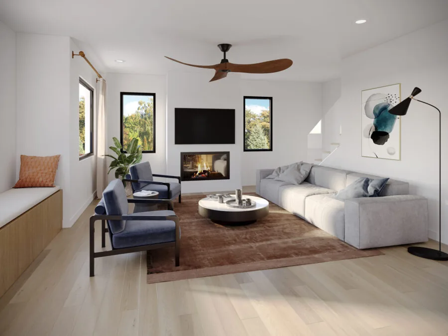 Modern living room with gray sofa, blue chairs, fireplace, TV, wooden ceiling fan, and large windows. (4 of 6)