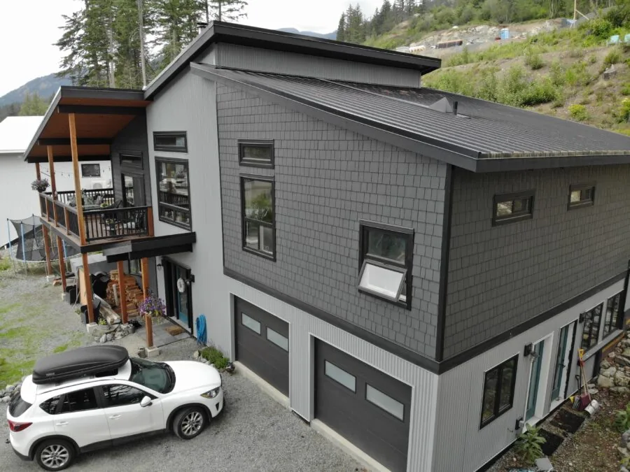 The mountain home seen against its setting