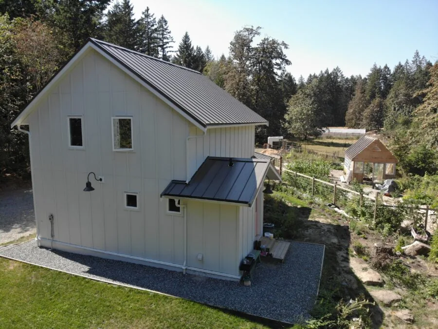 The covered porch and open frontage of the family farmhouse