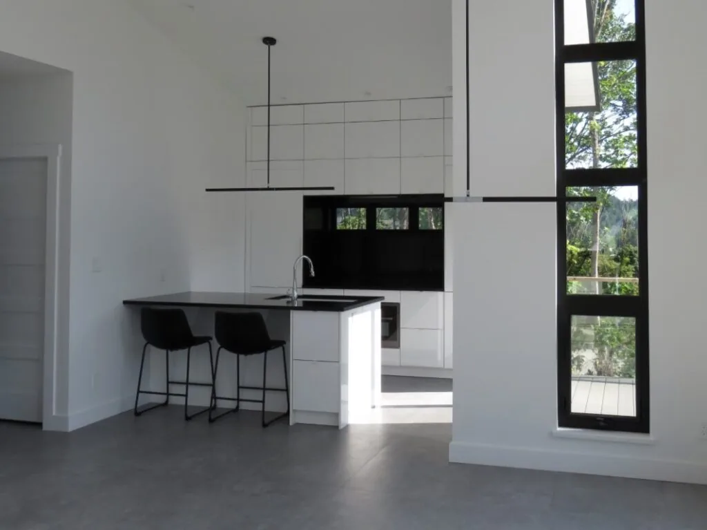 Kitchen and entrance to the modern house's upper floor deck
