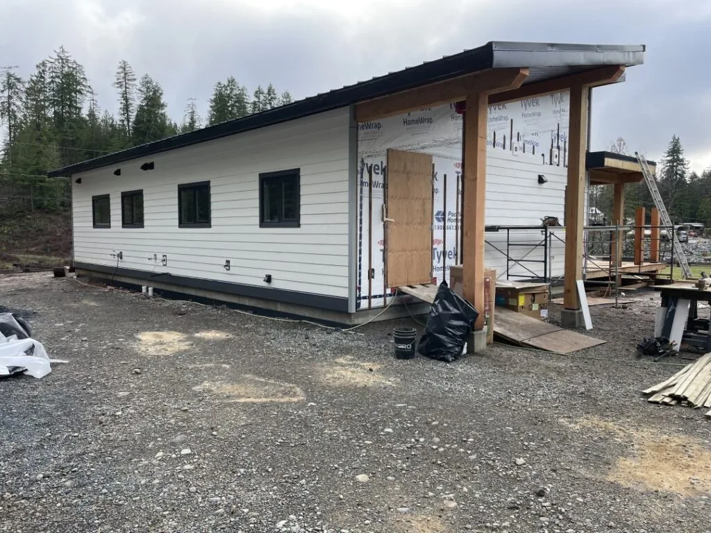 Back view of a nearly completed modern home